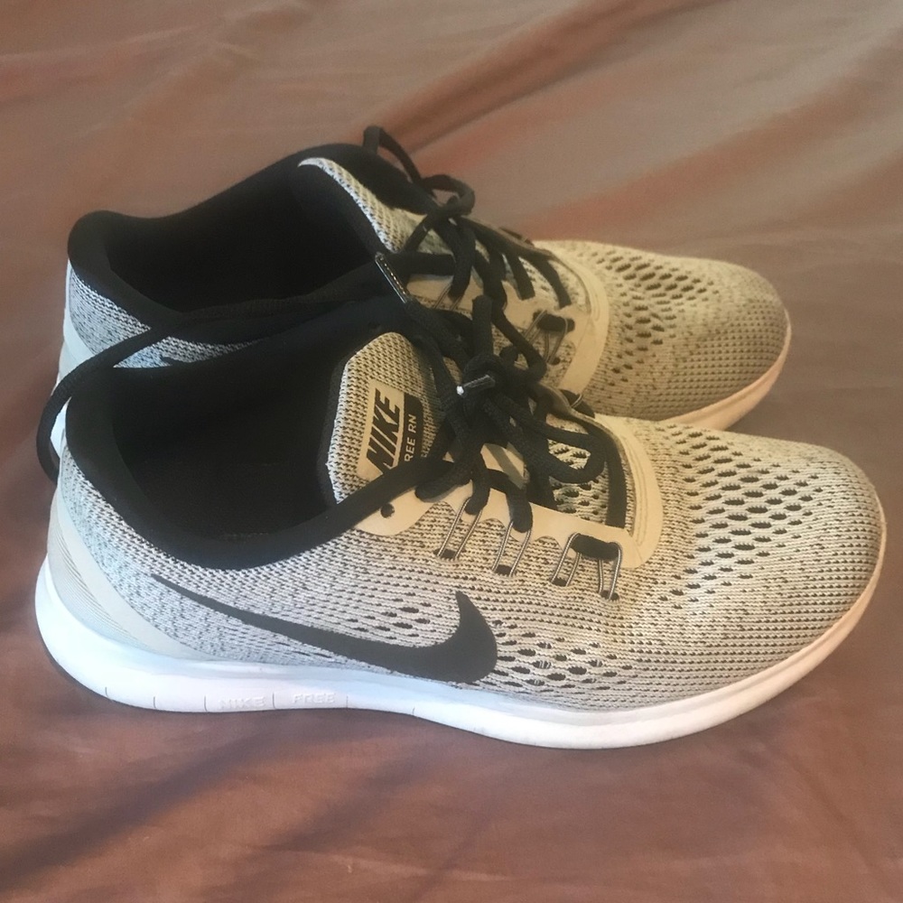 Black and grey Nike tennis shoes